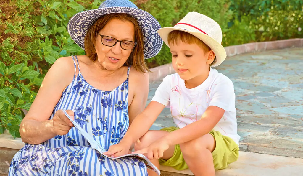 Grandmother reading with little boy