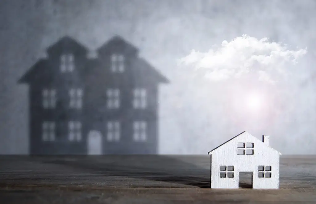 Smaller home in the shadow of a large home