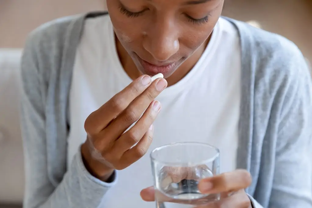 Woman taking medication