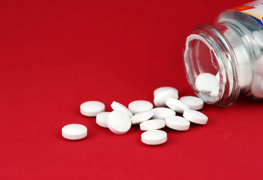 Aspirin Pills Spilling Out of Bottle