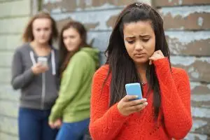 Girl being cyber-bullied