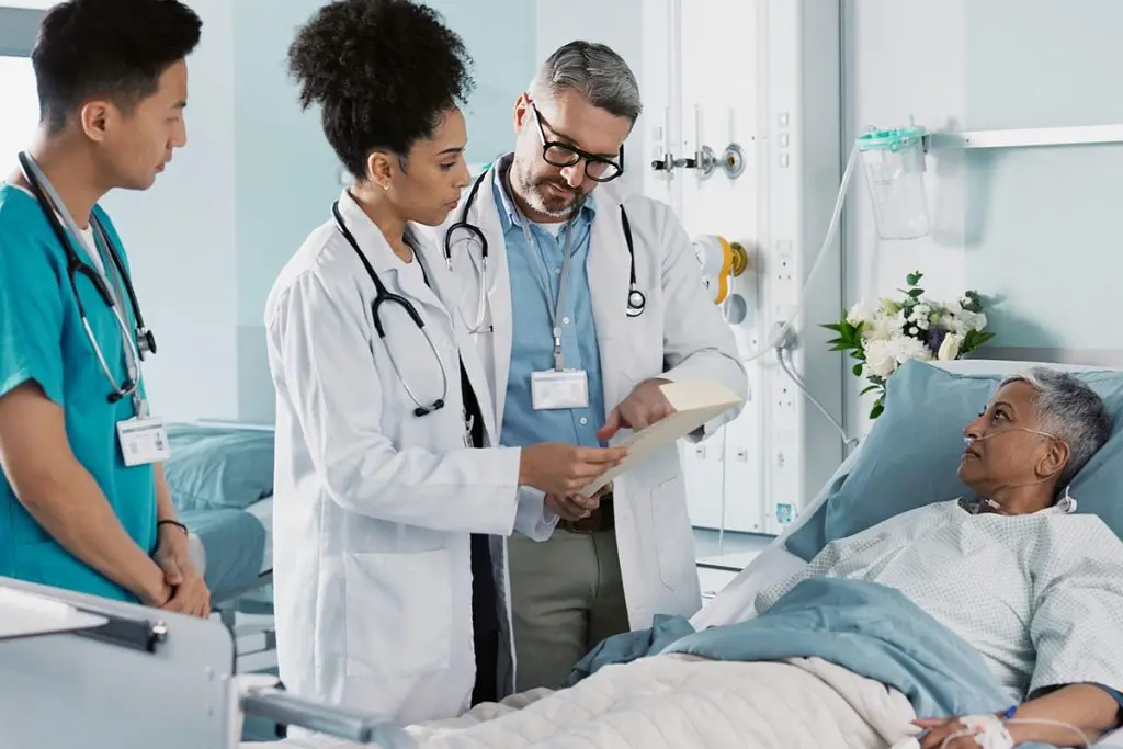 Three medical providers with a patient