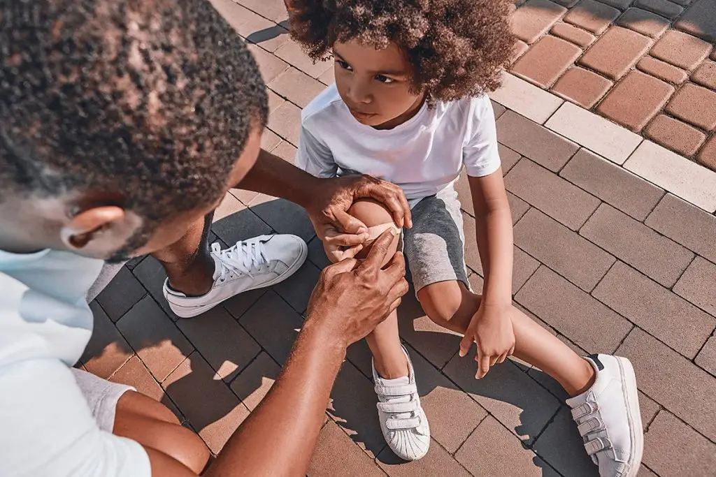 Dad treating a childhood injury