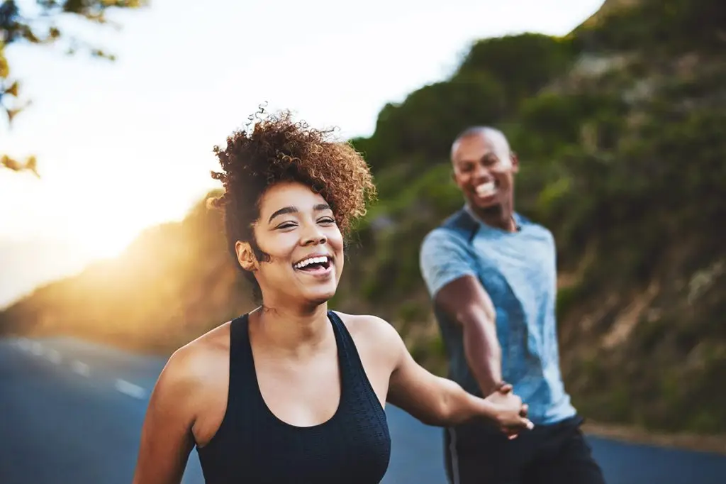 Man and woman happy and exercising outside