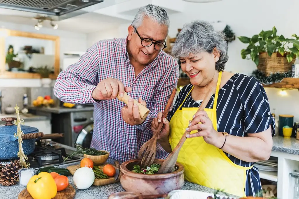 Man and woman cooking a holiday meal