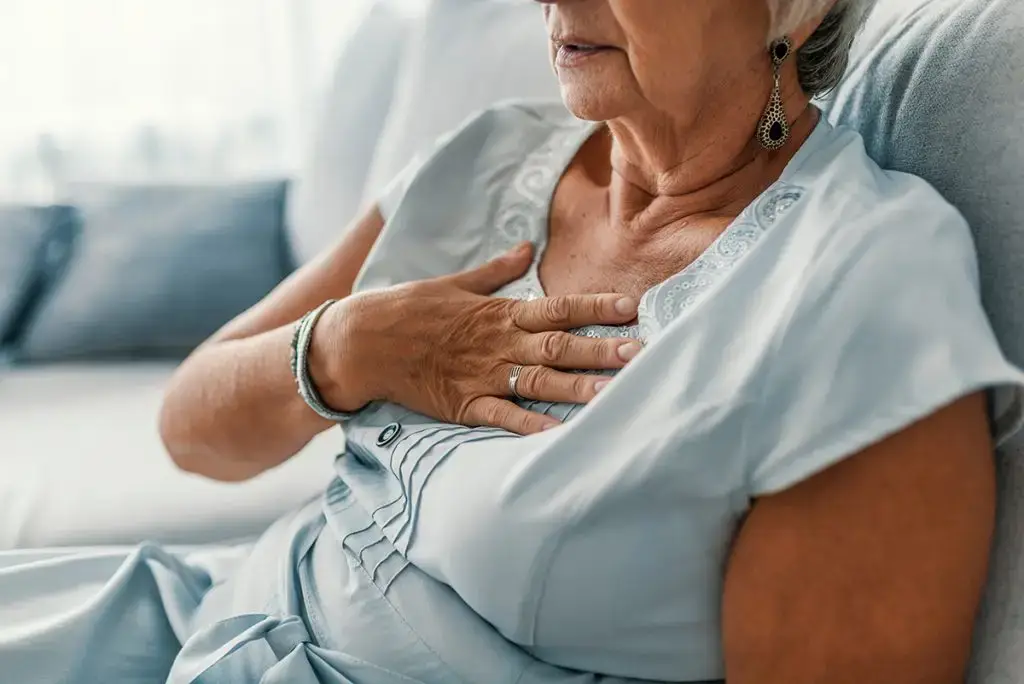Woman experiencing chest pain