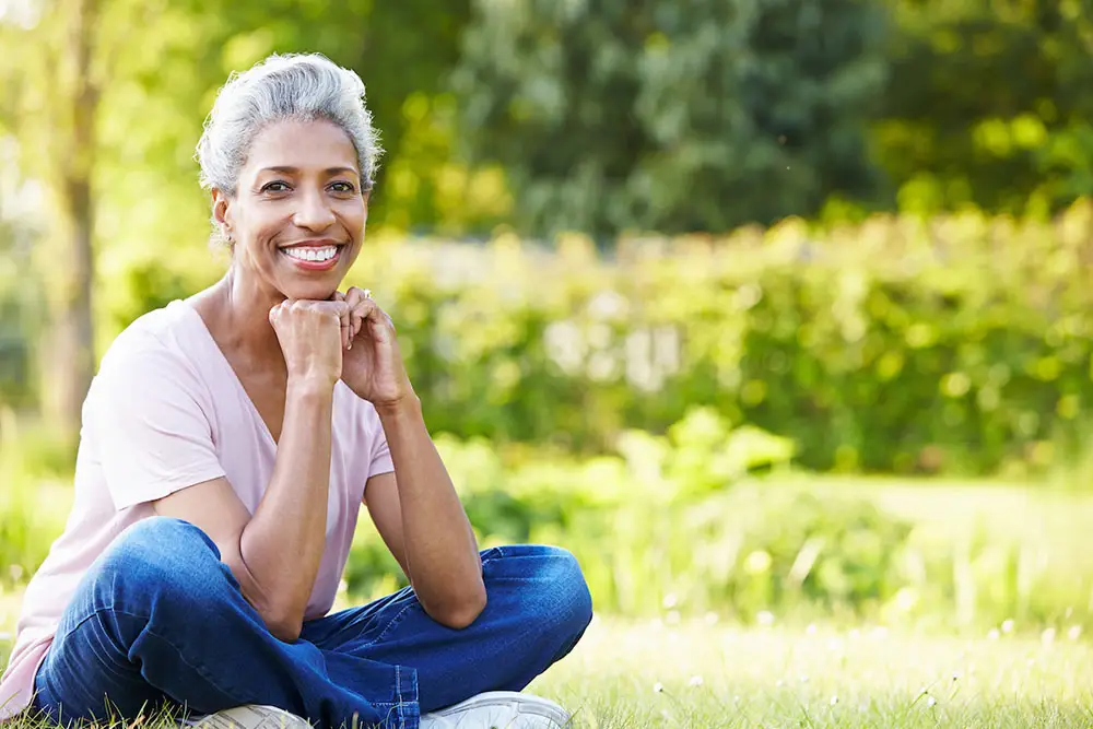 Beautiful middle aged African American woman sitting outside