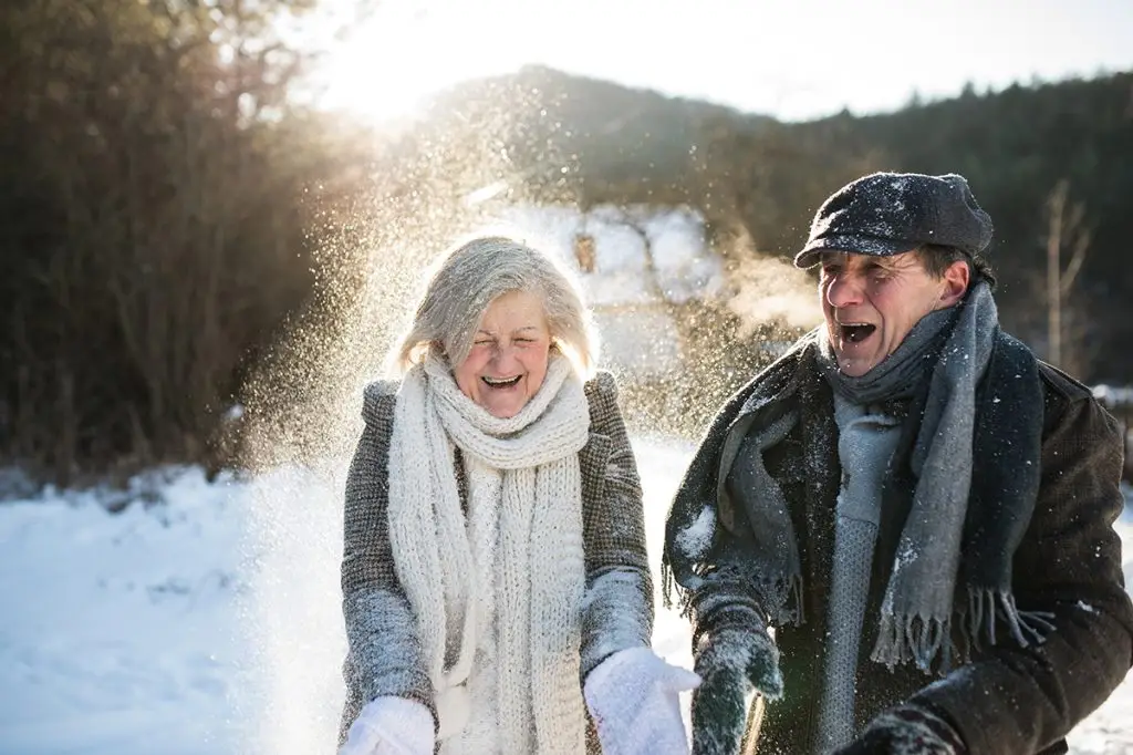 Older man and woman being active outside