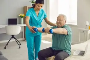 Man doing exercises with physical therapist