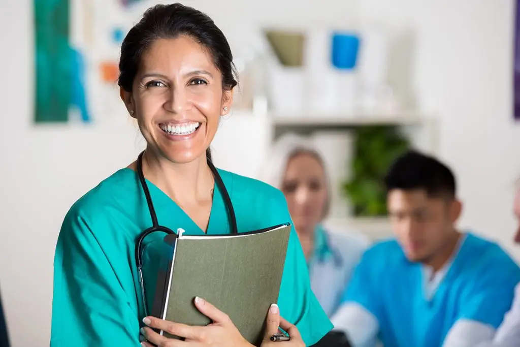 Confident female doctor in clinical setting