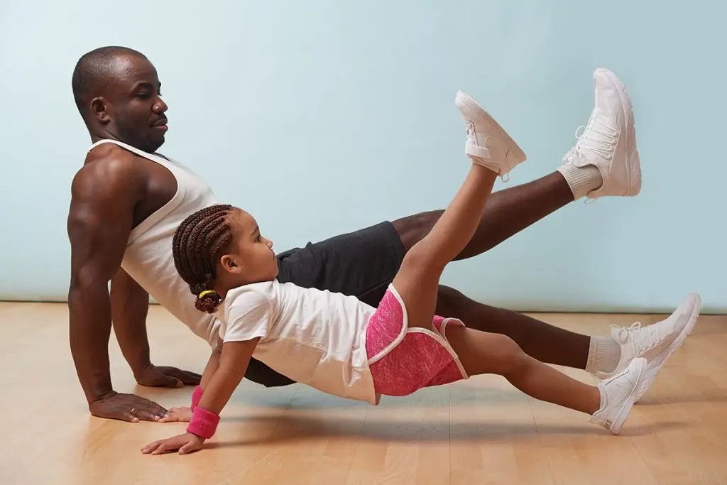 Dad and daughter exercising