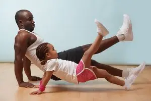 Dad and daughter exercising