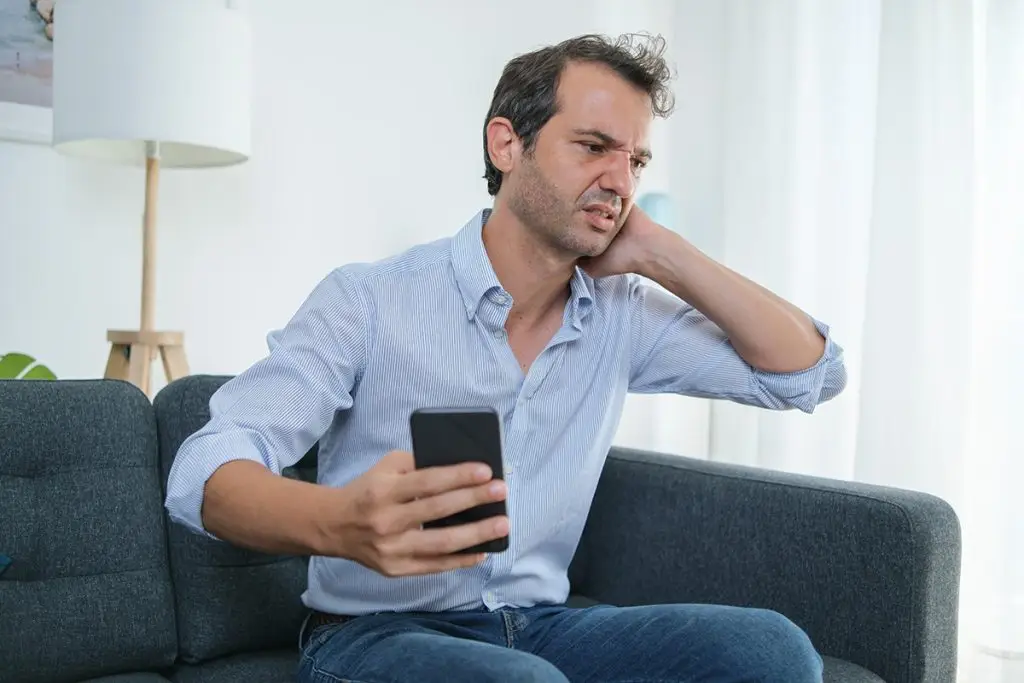 Man holding his neck in pain