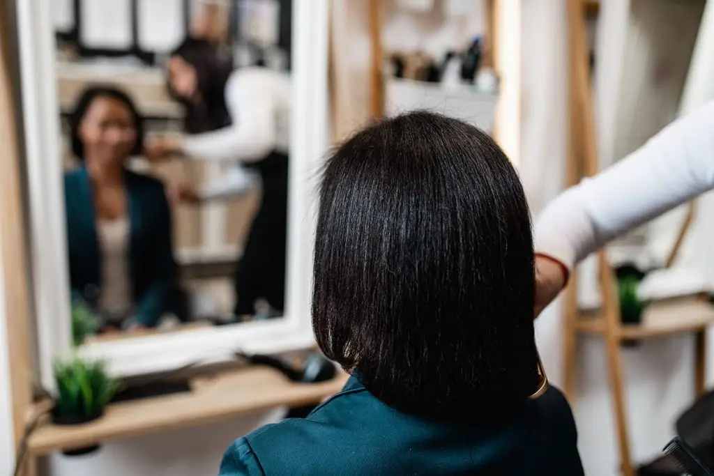 Woman getting her hair styled