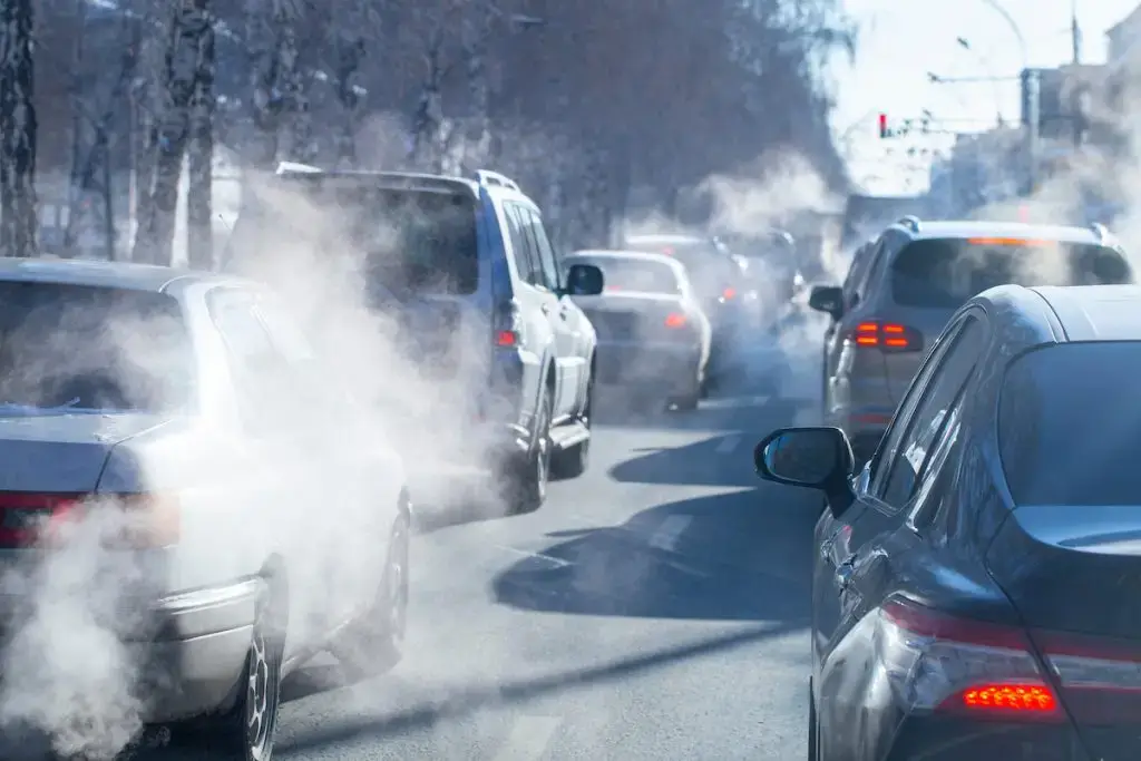 Smoke from cars on a cold winter day