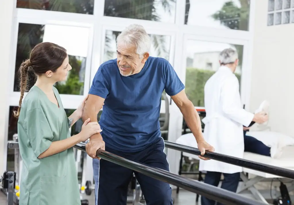 Man at rehab interacting with nurse