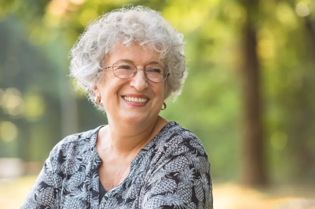Older woman smiling outdoors