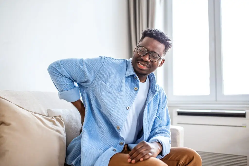 Managing Sciatica: Daily Habits to Find Pain Relief African American man feeling pain in lower back