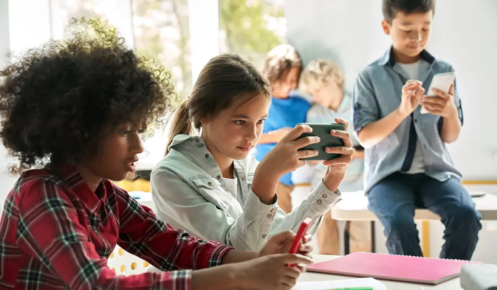 Kids looking at their phones