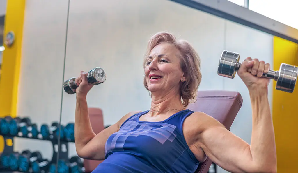 Mature woman lifting weights